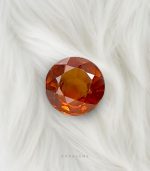 Top-grade natural Ceylon spessartite garnet 2.05 carat round stone, perfect for rings or pendants, available for buyers in Singapore, Qatar, Germany, UK, USA, Australia